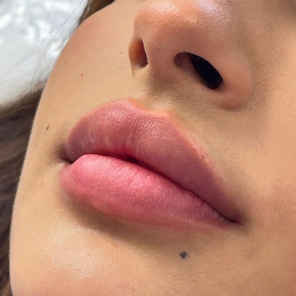 Beauty Mark Tattoo: 5 Placement Ideas for Every Face 4 Close-up of a person's nose, lips, and a small beauty mark tattoo on their chin.