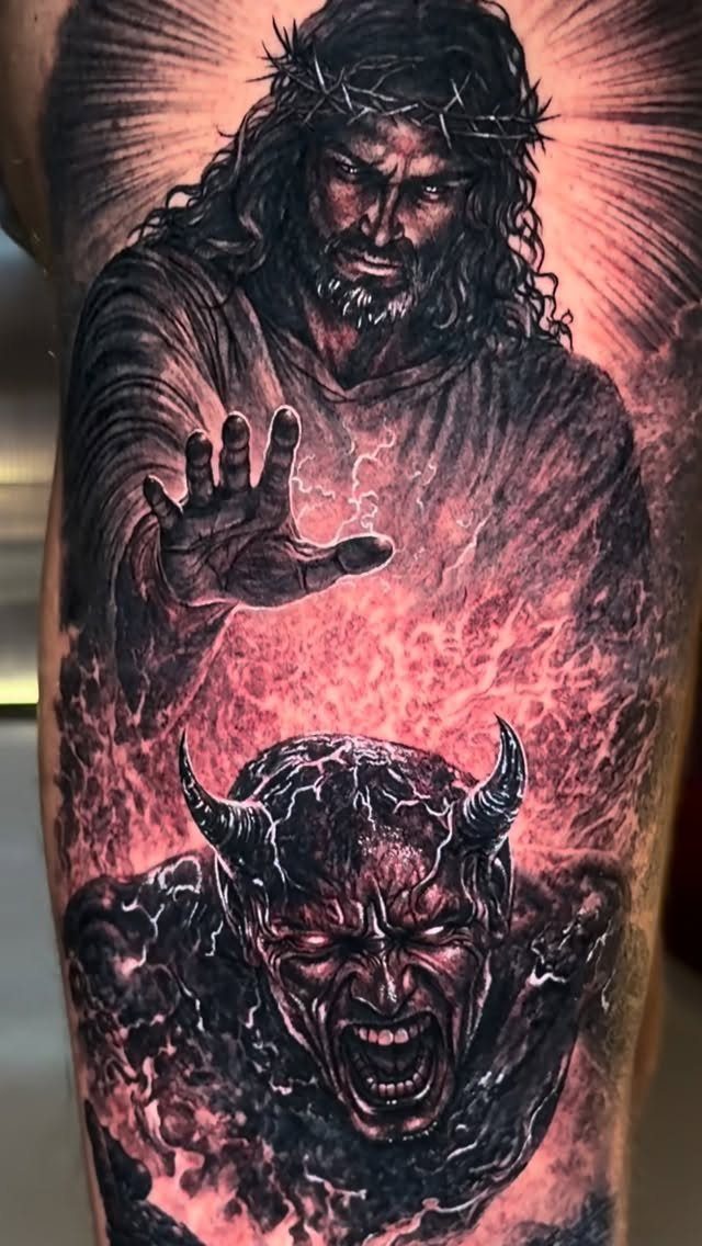 Good vs Evil Tattoo: 8 Designs That Split Skin Between Sides 8 A detailed black and red tattoo featuring a crowned figure and a screaming horned demon.