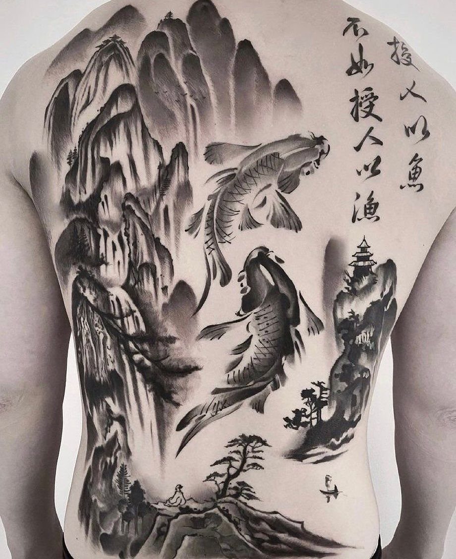 A large black and grey tattoo on a back depicting koi fish and a mountain landscape.