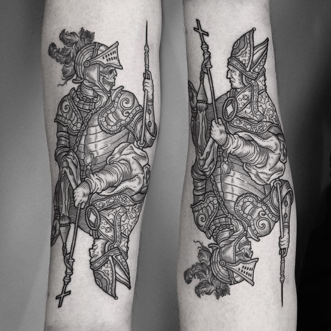 7 Knight Style Tattoo Ideas for 2026 2 Two detailed black and white tattoos on a person's legs featuring a skeleton knight and a robed figure.