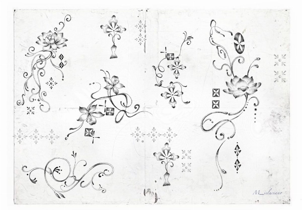 Stencil Tattoo Ideas: 14 Designs for Artists and First-Timers 12 Black ink floral and scrollwork patterns drawn on a white paper background.