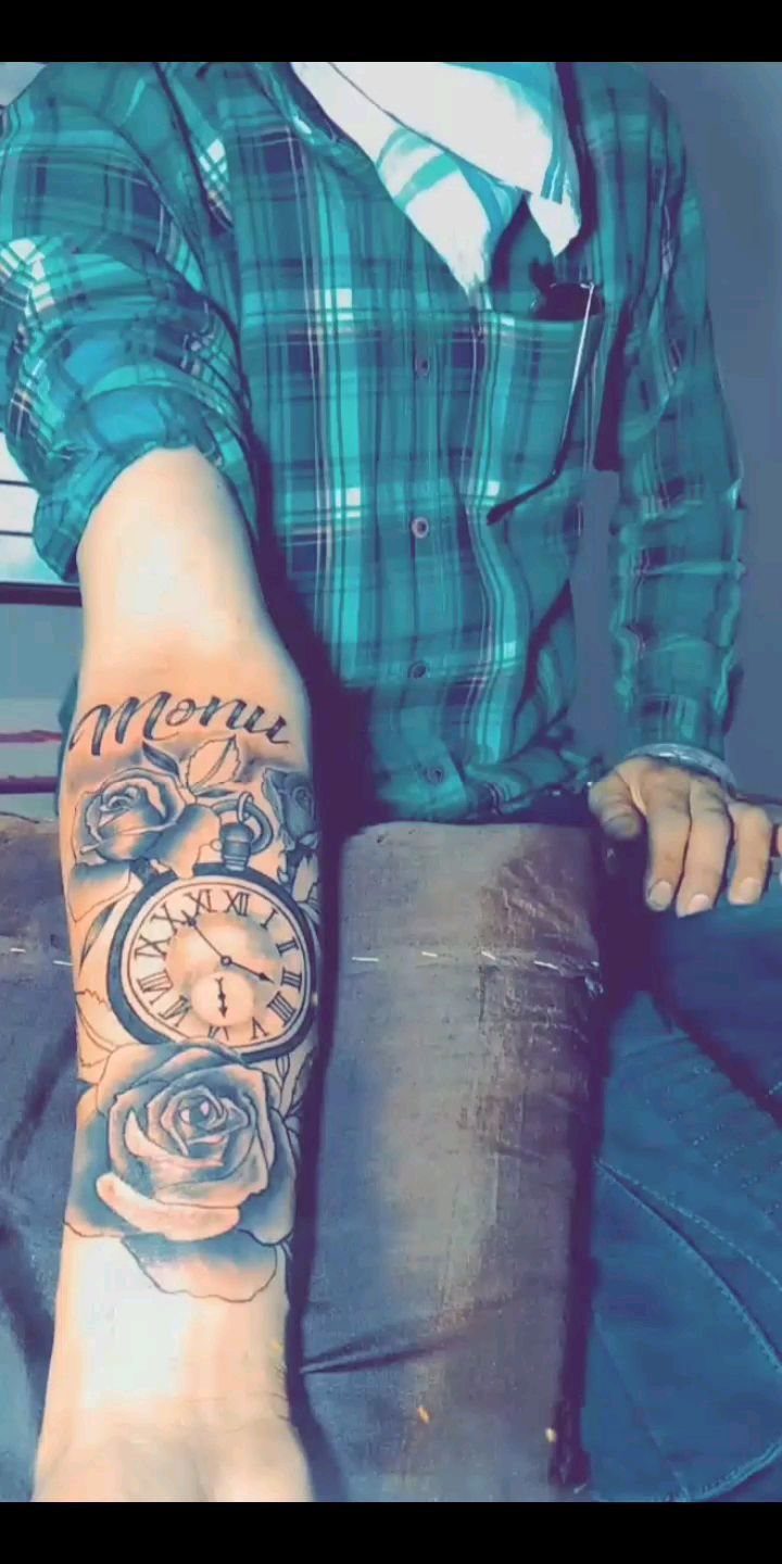 Tattoo Pattern for Beginners: 6 Starter Designs to Trace First 5 A forearm tattoo depicting a vintage pocket watch surrounded by large, detailed roses in black and grey ink.